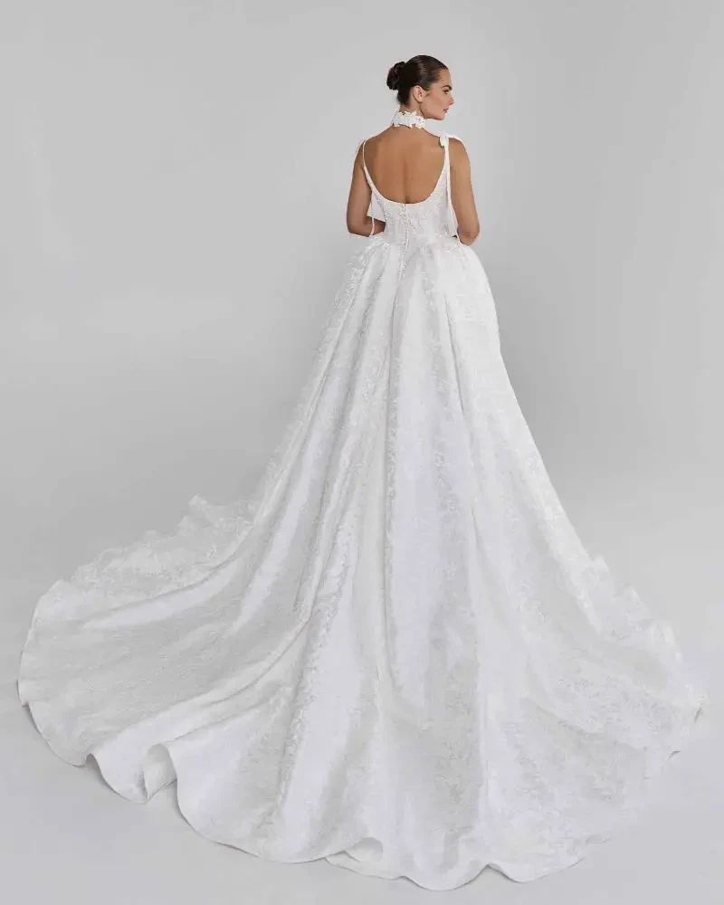 model is wearing a sleeveless ball gown