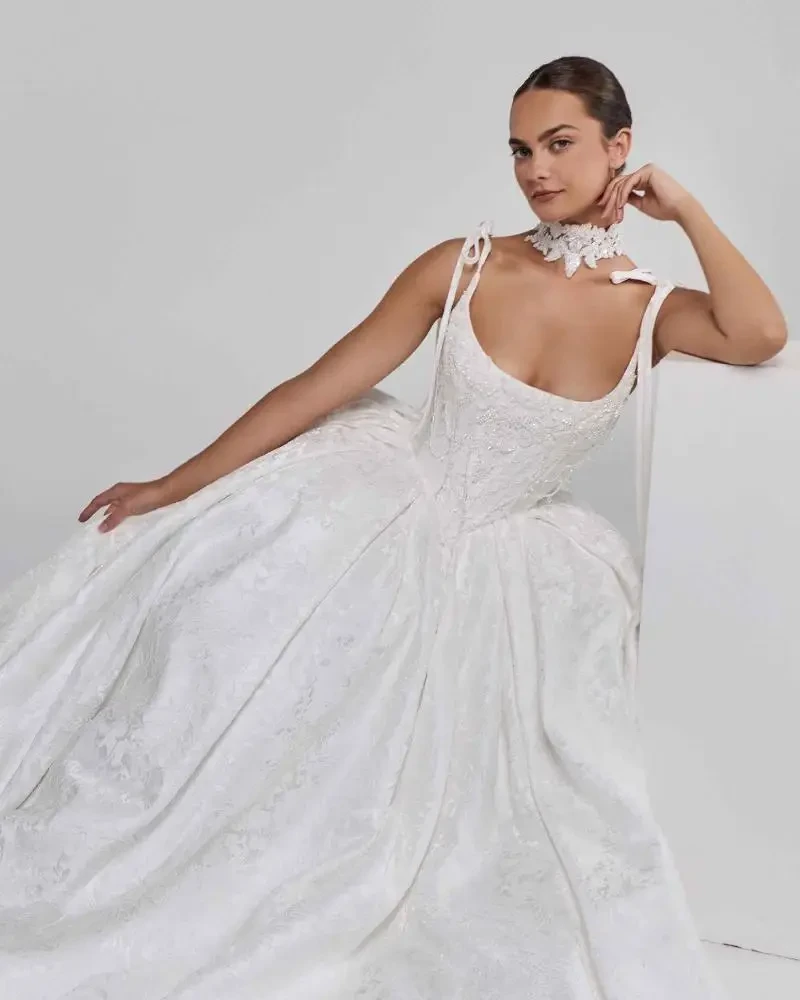model is wearing a sleeveless ball gown