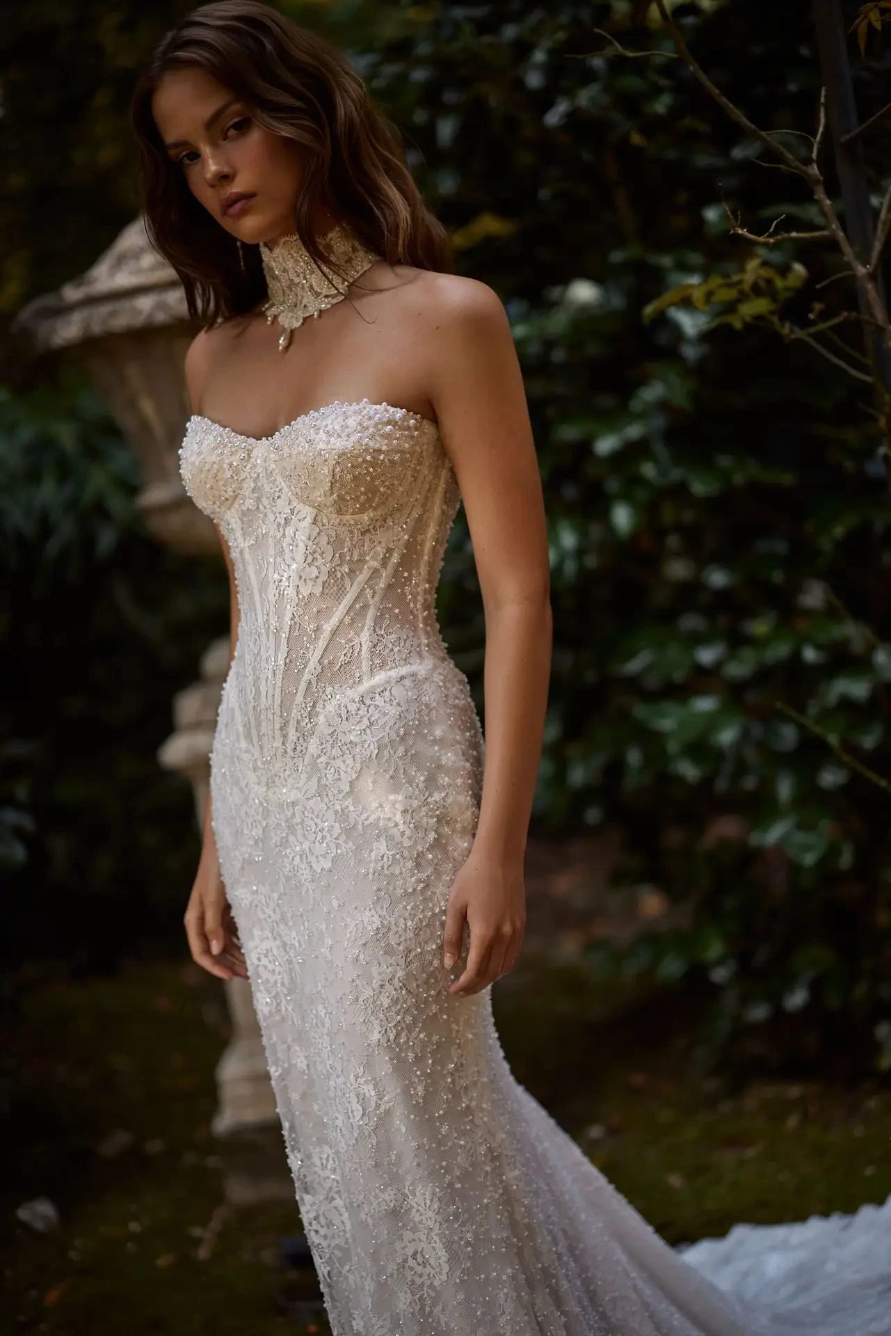 model is wearing a strapless beaded and embroidered wedding dress from galia lahav