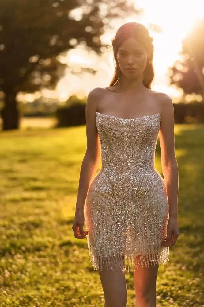 model is wearing a mini bridal gown