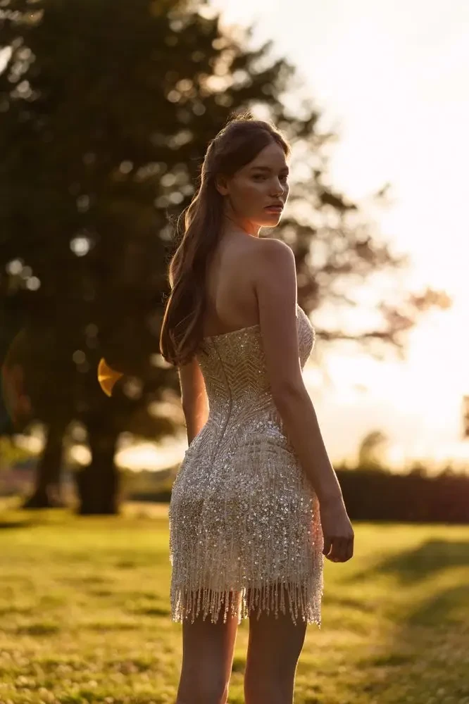 model is wearing a mini bridal gown